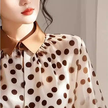 Load image into Gallery viewer, Close-up of a person wearing a polka dot blouse with a neutral background