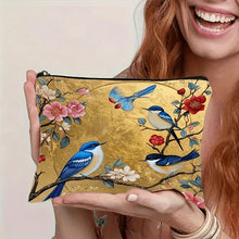 Load image into Gallery viewer, Person holding a pouch with floral and bird design on a plain background