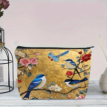 Load image into Gallery viewer, Cosmetic bag with bird and floral design on a wooden surface