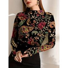 Load image into Gallery viewer, Woman wearing a black long-sleeve top with colorful paisley pattern against a neutral background