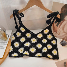 Load image into Gallery viewer, Black crochet top with white floral patterns on a hanger against a light background