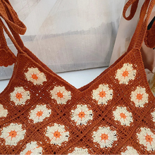 Load image into Gallery viewer, Brown crochet top with floral patterns on a neutral background