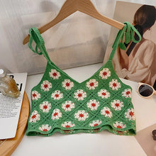 Load image into Gallery viewer, Green crochet top with floral pattern on a hanger