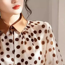 Load image into Gallery viewer, Close-up of a person wearing a polka dot blouse with a neutral background
