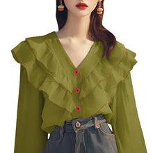 Load image into Gallery viewer, Green blouse with ruffled details and pink buttons worn by a model on a white background