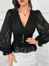 Load image into Gallery viewer, Black blouse with sheer sleeves and pearl buttons on a white background
