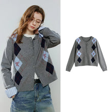 Load image into Gallery viewer, A gray knit cardigan sweater with argyle diamond patterns in navy, light blue, and red on the front, shown both on a model and as a flat product shot against a light gray background.