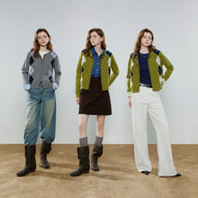 Load image into Gallery viewer, Three women model matching knit cardigan sweaters in different colorways against a neutral studio backdrop. The left model wears a gray argyle cardigan with blue jeans and black boots.