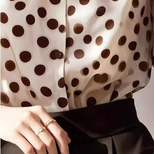Load image into Gallery viewer, Close-up of a person wearing a polka dot blouse with a neutral background

