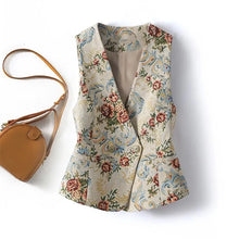Load image into Gallery viewer, Floral patterned vest with a brown handbag on a white background
